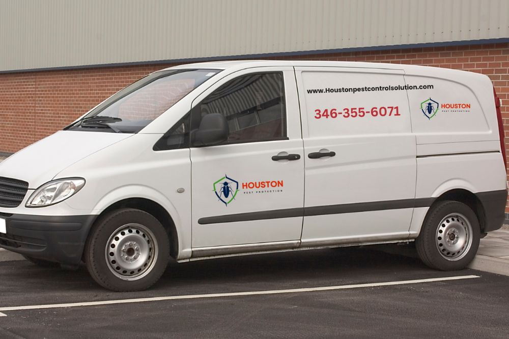 A white van is parked outside a pest control service building in Houston, Texas.
